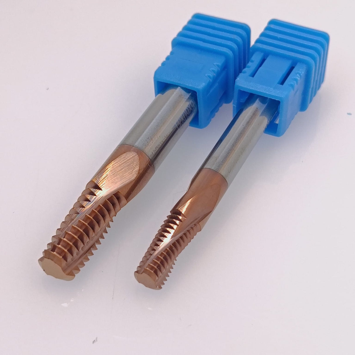 Two coated thread cutting taps