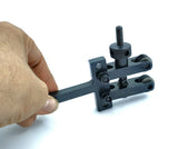 Hand holding a knurling tool