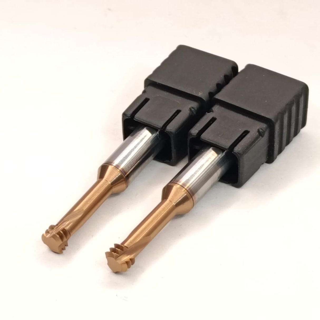 Two metal drill bits in a black plastic holder