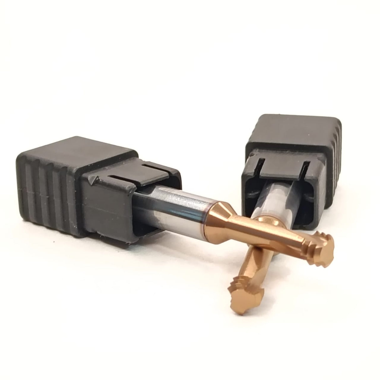 Mechanical component with black housing and gold and silver parts 