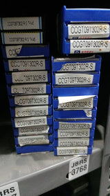stack blue and silver metal cutting inserts 