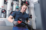 Plumber using plastic pipe cutter tool