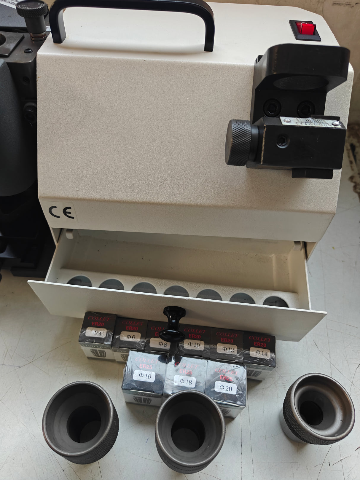 White machine with a drawer containing 