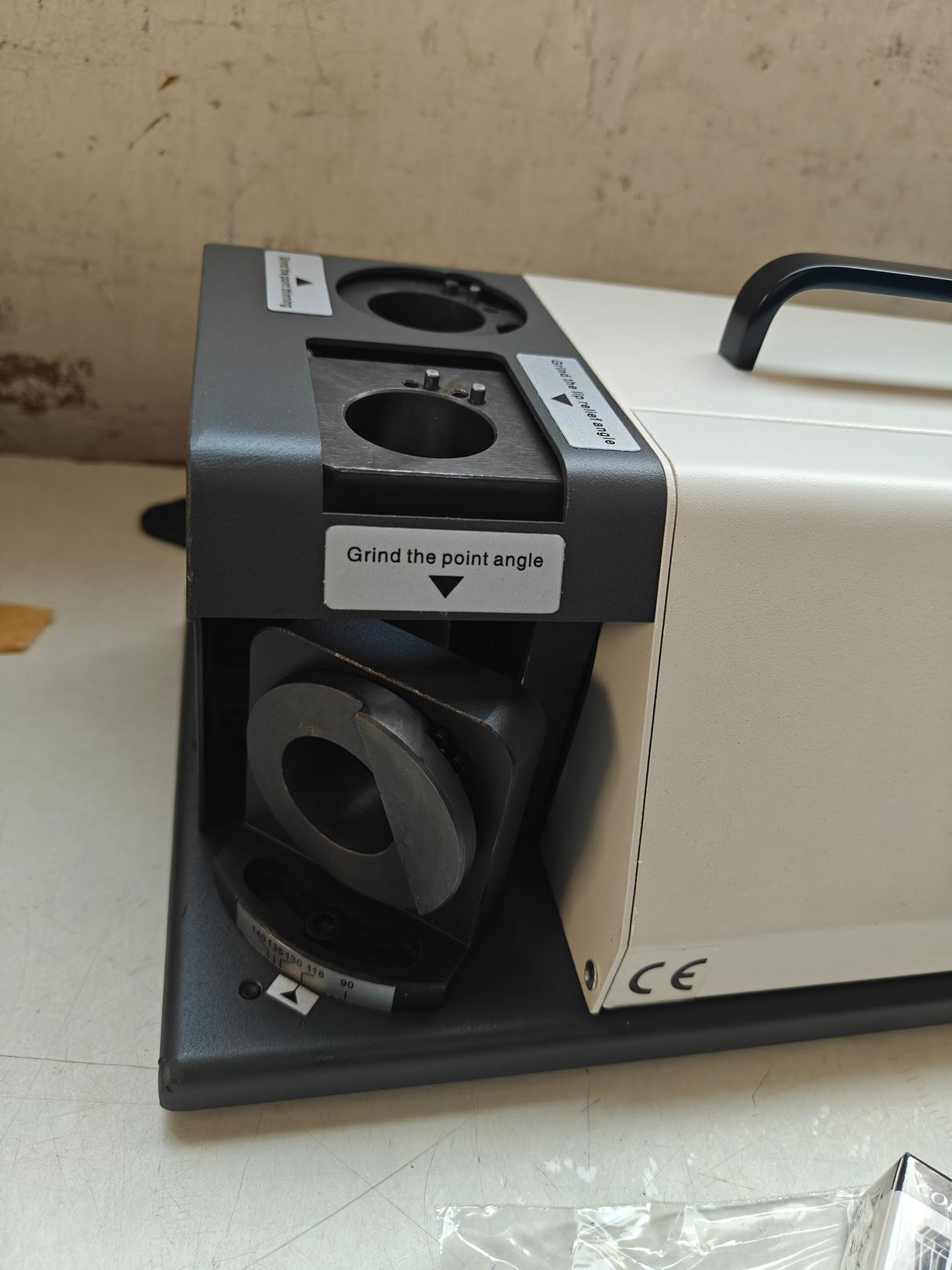 Electrical outlet with grinding attachment 