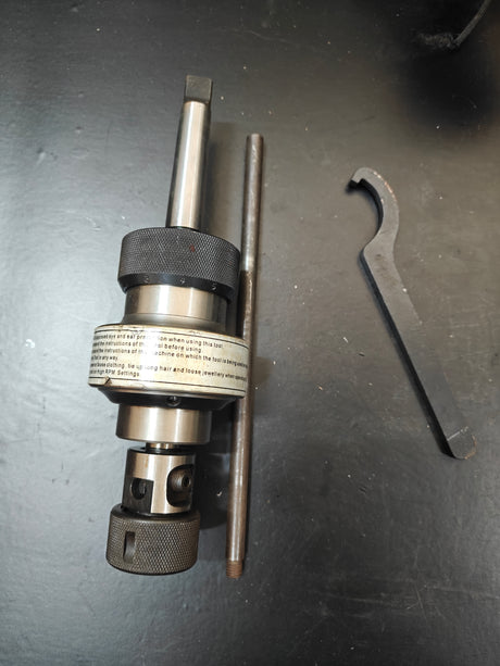 Tapping head and wrench