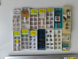 Assorted CNC inserts in storage cases