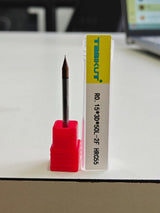 Nail drill bit in a red holder 