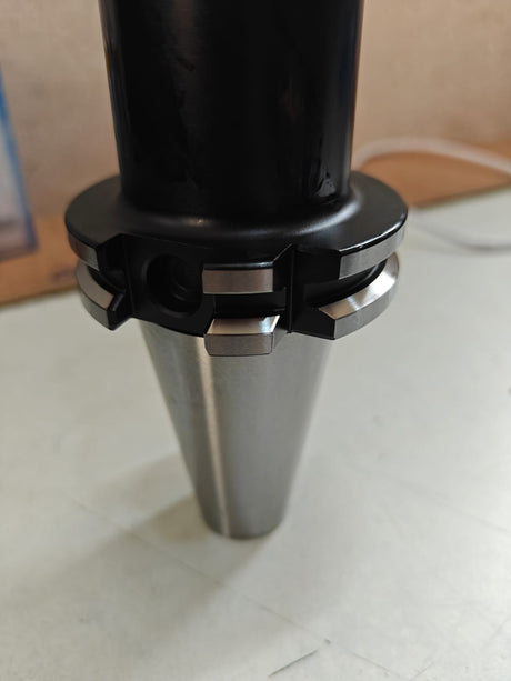 Black and silver cylindrical object 