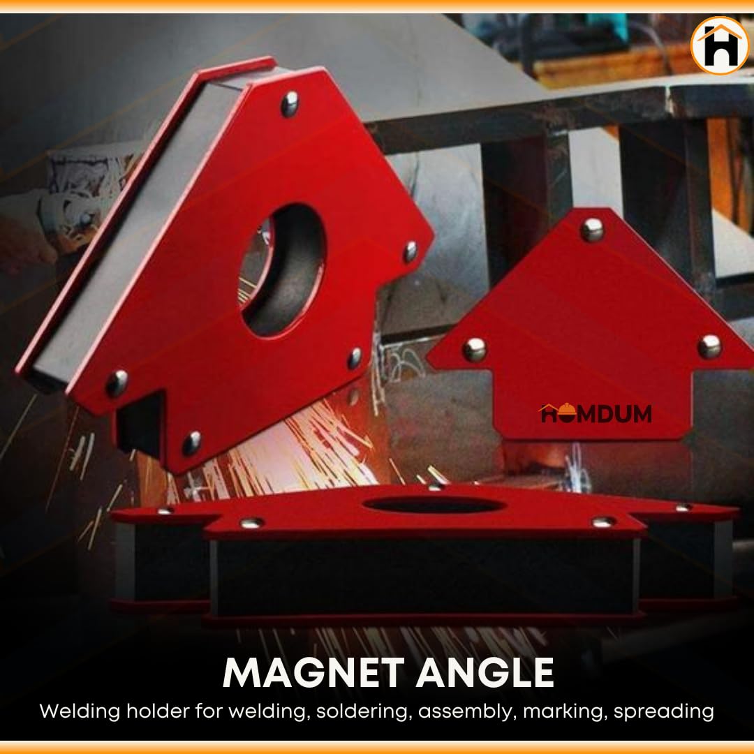 Red magnetic welding clamps holding metal with sparks in background
