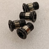 Four black Torx head insert screws