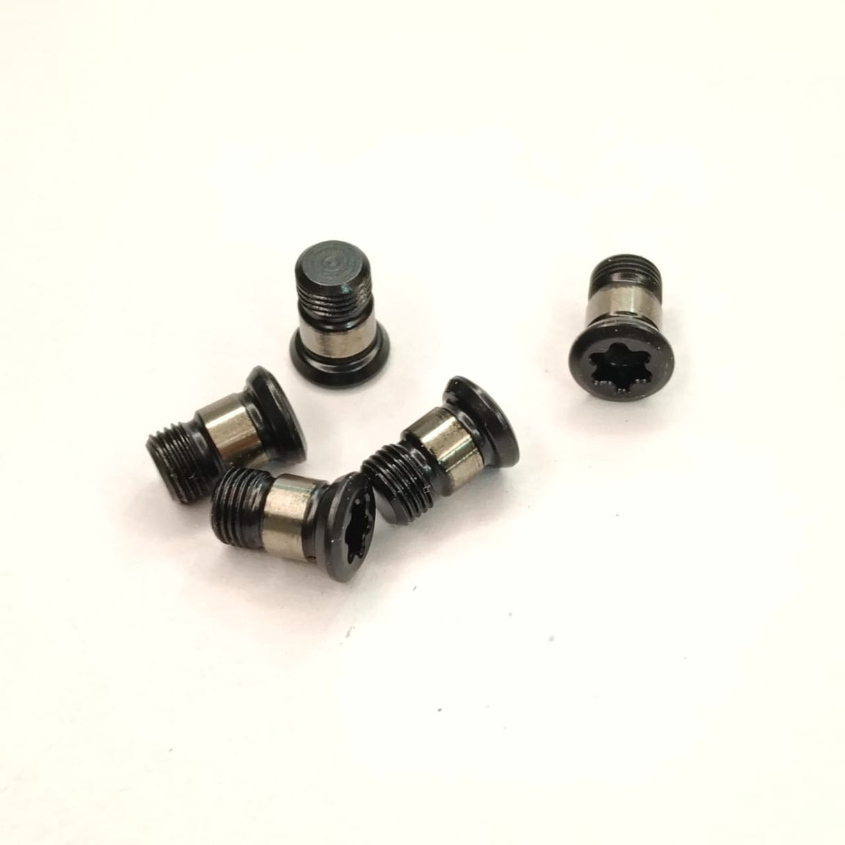 Five black Torx insert screws