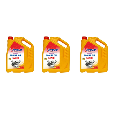 Three yellow engine oil bottles with red caps 