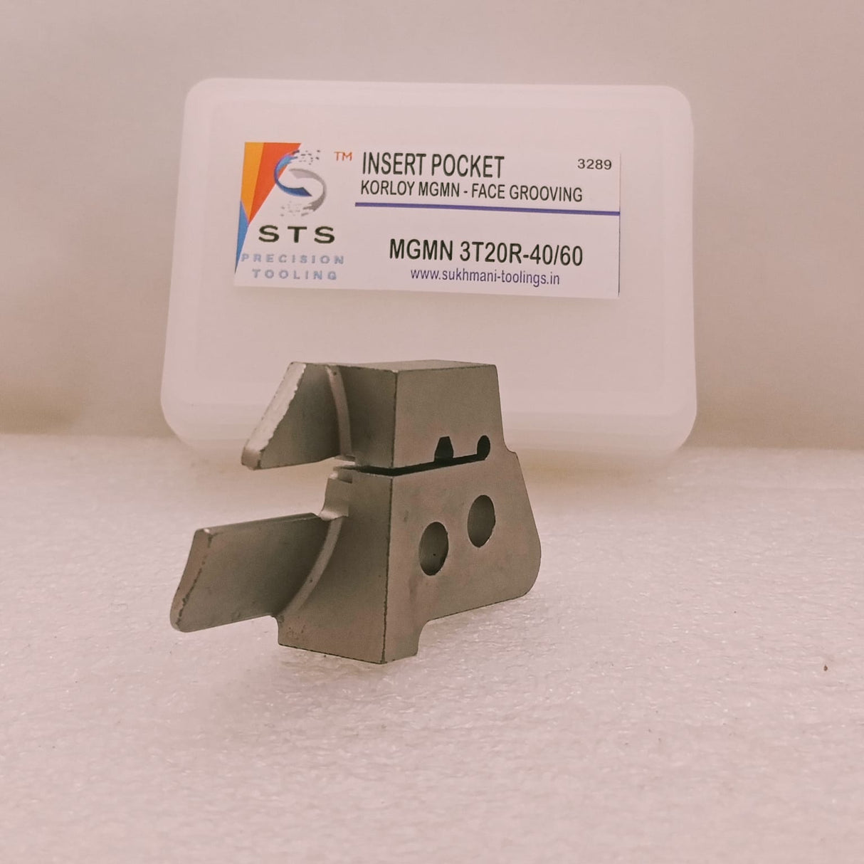 Metal tool insert with STS branding