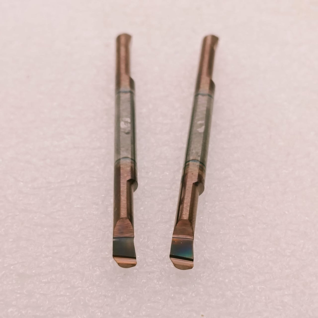 Two metal turning tool inserts