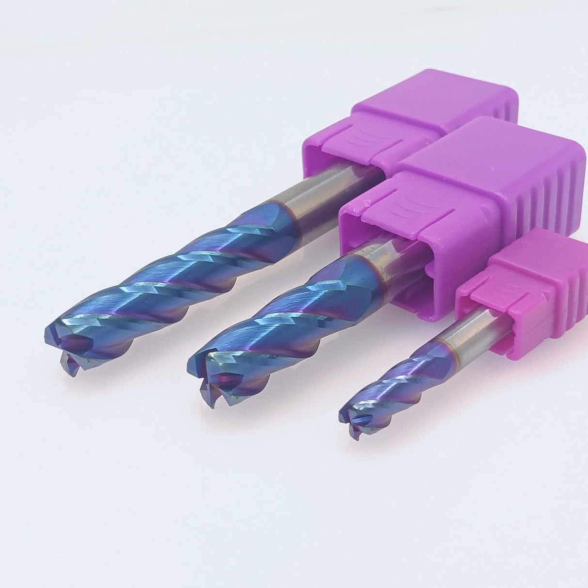 Three blue coated end mills